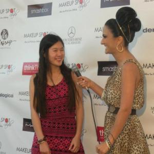 Actress Tina Q. Nguyen getting interviewed by Taguhi Tracy Oganyan at the Makeup Spot Studio Grand Opening in North Hollywood on July 5, 2012.