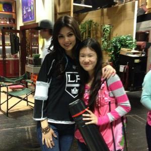 Actress Tina Q Nguyen and actresssinger Victoria Justice on the set of Nickelodeons Victorious