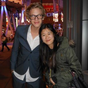 Singer Cody Simpson and Tina Q Nguyen at Lionsgate The Hunger Games world premiere at Nokia Theatre LA Live on March 12 2012