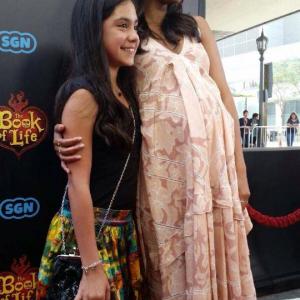 Genesis Ochoa with actress Zoe Saldana at the Los Angeles premiere for The Book of Life