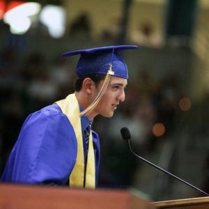 Speaking as valedictorian at 2011 graduation.
