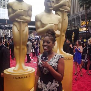 Host of Studio 3 Hollywood, Tysha live on the Red Carpet arrivals for the 56th Annual Academy Awards. Wearing Shekhar Rehate designer gown and American Gem Company Jewelry