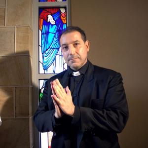 Here I play a Serial killer impersonating a priest in the film I Am What I Am