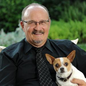 W Mark Dendy at home with his dog Pancho Via