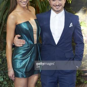 Alexandra Siegel poses for photographers as she arrives with screenwriter Jason Fuchs for the World Premiere of 'PAN' in London's Leicester Square on September 20, 2015.