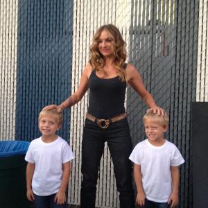 Evan Londo with twin brother Ryder and Drea De Matteo on the set of Sons of Anarchy Season 7