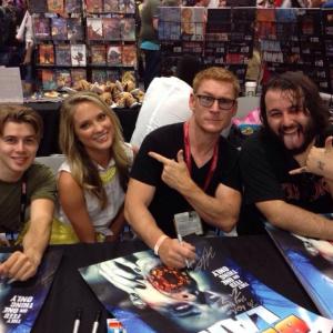 Nicholas Clark, Ciara Hanna, Zack Ward, and James Cullen Bressack signing autographs at Comic Con 2014 in San Diego.