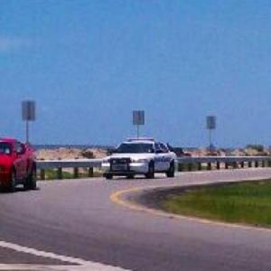 Movie cop car chasing our Shelby GT500 in a screenshot from My Heart Dies With You