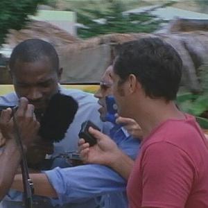 Mehmet Mizrap surrounded by reporters in the French West Indies in Tomorrows Heroes