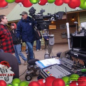Michael E Bierman chatting up cinematographer Mitchell Lipsiner between takes on the set of Santas Boot Camp