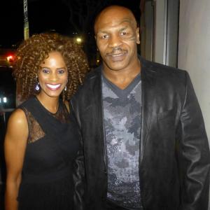 Host Germany Kent attends the Premiere of Draft Day in Westwood, pictured with Iron Mike Tyson