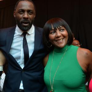 Nelson Mandelas daughter Makaziwe R and British actor Idris Elba who plays the role of Nelson Mandela in the movie Mandela Long Walk to Freedom pose together as they attend the movies premiere in Johannesburg on November 3 2013