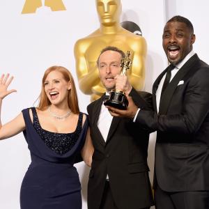 Idris Elba Emmanuel Lubezki and Jessica Chastain at event of The Oscars 2015