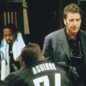 #47 Jose Giles (Dennis Jay Funny) & fellow Shark players listen to the Coach's (Al Pacino) 
