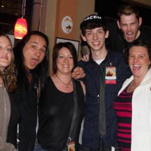 Actors from Left to Right Dango Nu Yen Jerrad Vunovich and Michael Koske from The Walking Dead with fans at a Walking Dead after party in Penscola FL