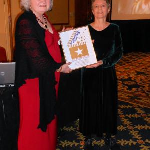 Jean Lorrah (left) and Lois Wickstrom (right) with their Gold Remi for Family Screenplay, WorldFest 45, April, 2012.