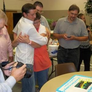 Vanished leading man Richard Bubba Bryant upon seeing his surprise birthday cake hugs film producer Candy J Beard August 2013