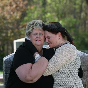 Providence grieving sisters Cynthia Birdsong and Brenda Jo Reutebuch