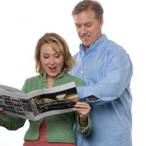 John Elway and Meredith Thomas in a print advertisement for Toyota