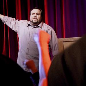 Michael McIntyre as Jeremiah South leads a Restore America rally in a scene from The Messenger
