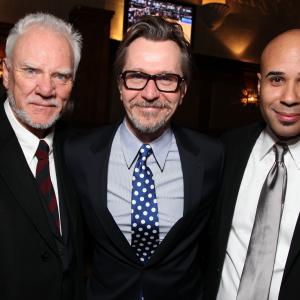 Actors Malcolm McDowell Gary Oldman and ManagerProducer Chris Roe Malcolm McDowell Honored With A Star On The Hollywood Walk Of Fame on March 16 2012 in Hollywood California