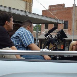 Michael Walters and Carlos Tovar preparing to go shoot B-roll from the back of the truck, in 