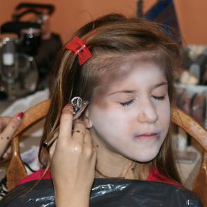 Gloria getting her makeup done for her first ZOMBIE film