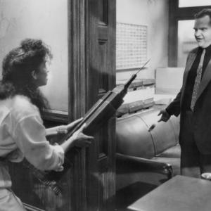 Still of Rae Dawn Chong and Meat Loaf in The Squeeze 1987