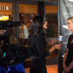 Gemita Samarra doing a live segment for Fox News at the Aston Martin event in San Diego for the Premiere of Spectre