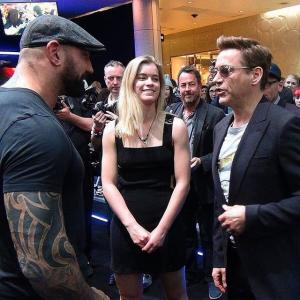 Dave Bautista Left Gemita Samarra Middle Robert Downey Junior Right at the Avengers Age of Ultron Premiere