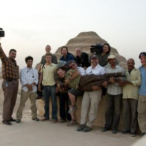 TV director Ian Stevenson middle holding host Scotty Moore with crew of Discovery Channels Bone Detectives on location in Egypt More at wwwianstevensontv