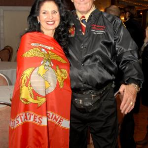 Gary Shihan Alexander with Events Hostess Lonnie Saluting the United States Marine Corps