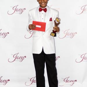 Elijha with his trophy win at the 2014 Joey Awards