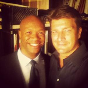 Isaac Johnson and Nathan Fillion on set of Castle