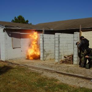SWAT Team Explosive Breacher blowing a 50gr Duct Tape charge on a Class I Metal Door