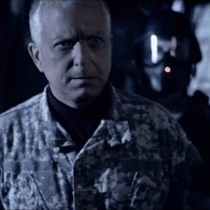 Screen grab from THE GRID with Mihlon as General Keller