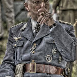 As a dirty and tired, captured German officer.