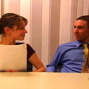 Greta (Christina Bedway) and Guy (Gordon Clark) prepare for a meeting in 
