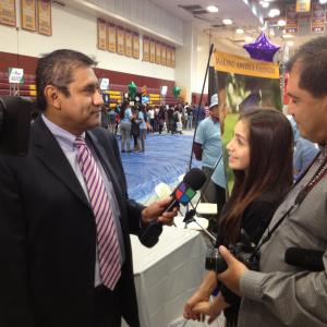 Samantha being interviewed by Univision after performing for them at a festival.