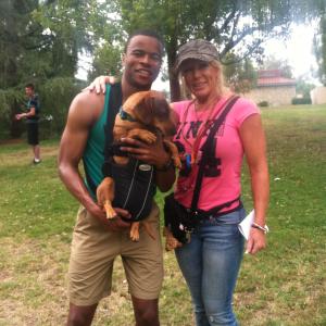 KT Hart and Marque Richardson  Reggie dog who plays Crusher in Wiener Dog Nationals The Movie shot July 2012WriterCreator Kevan Peterson