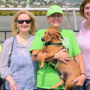 Reggie at Del Mar for Wienerschnitzel Wienernationals regional qualifier finals Pictured with him is Michele Shoemaker of Sunny Oasis Rescue Anne Mcfassett Fan Club President with Melinda Smith his racing coach and starter Stacy ROO Smith