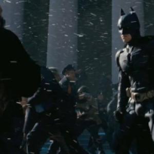 From The Dark Knight Rises I am the police officer in the orangelined raincoat between Bane and Batman Screen shot from TDKR trailer two