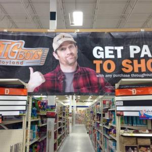 Simon Provans recurring role in the Mills Fleet Farm commercials is now also featured throughout the stores in print ads banners and lifesize cutout for postChristmas sales event