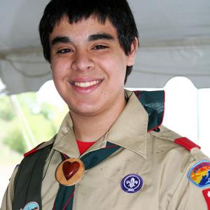 This is me in my Boy Scout uniform I was raising money for my Eagle Scout project by selling candy bars at a local festival