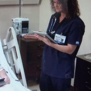 Kimberly J. Richardson as Nurse Susan in a medical training video.