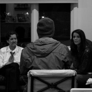 Discussing a scene with talent (from L to R): Brian Rooney, Michael Bachochin, and Kelly Steward.