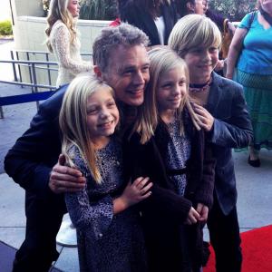 Camden and her sister, Carsen, and brother, Aiden, with John Schneider at the premiere of, 