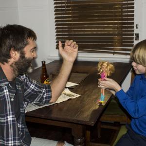 Fragile Chill out time with my on set son Alex and being challenged by his favourite Barbie to a arm wrestle....