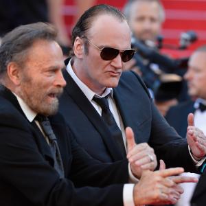 Quentin Tarantino and Franco Nero at event of Uz sauja doleriu (1964)