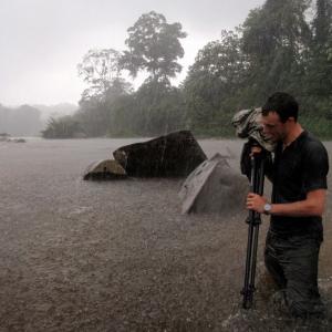 Documenting petroglyphs while wading through the Rio Platano during a torrential rainstorm in Honduras I was the lead photographer on a National Geographic archaeological expedition into La Moskitia